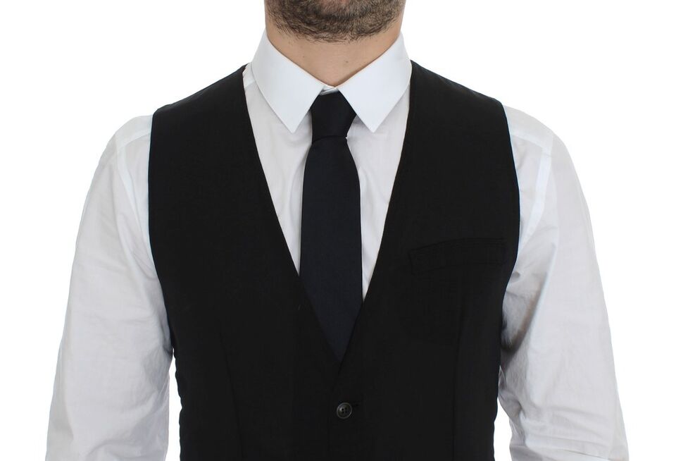 A black wool vest with a gilet style jacket, featuring a lapel collar and two front pockets