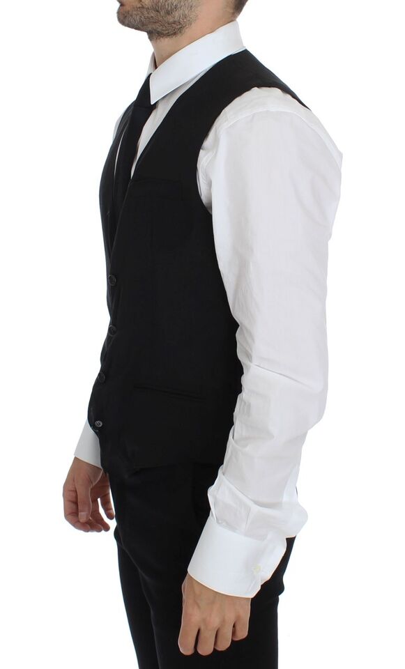 A black wool vest jacket with a lapel collar, worn by a mannequin