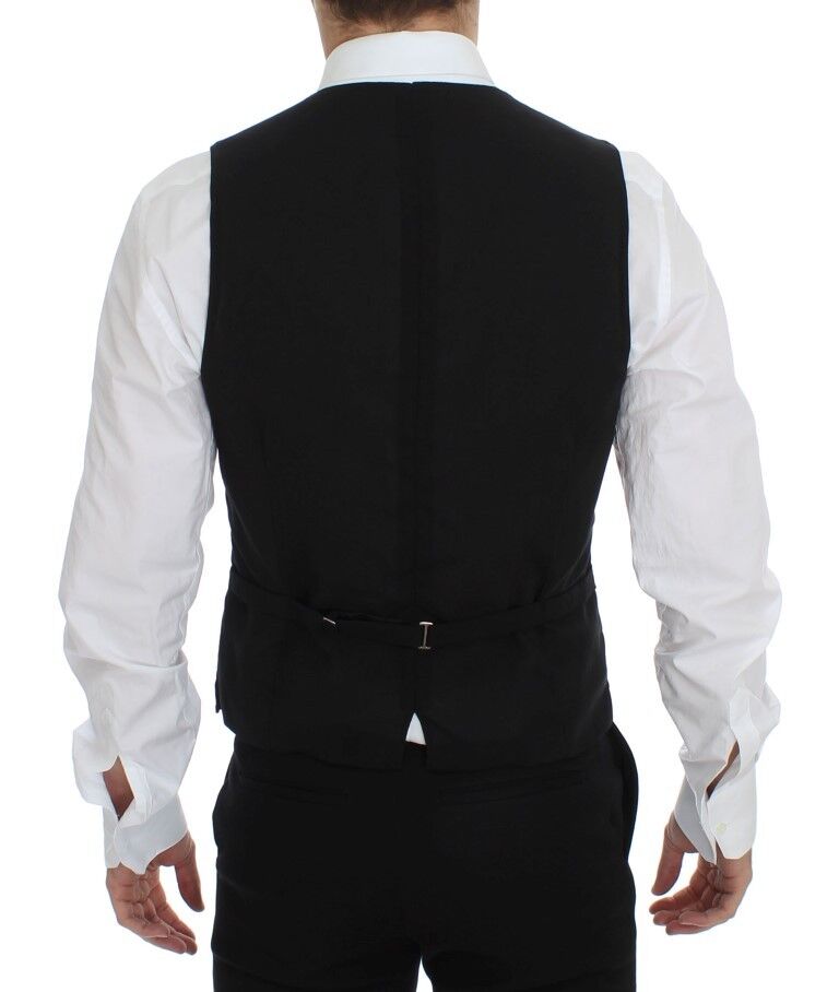 A black wool vest with a lapel and belt loops, part of a formal dress ensemble