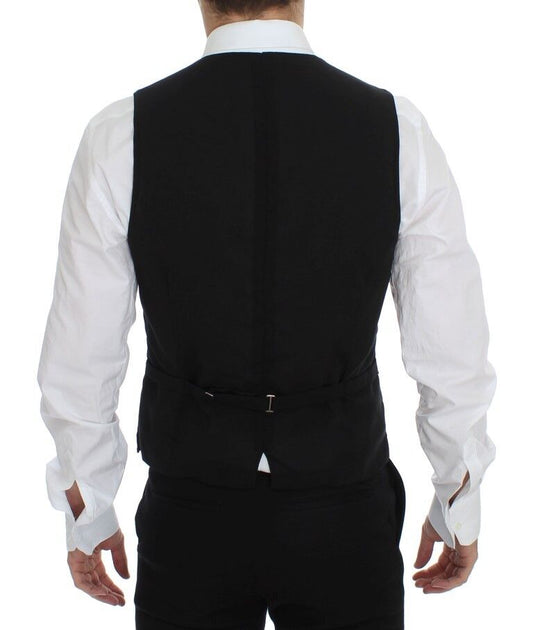 A black wool vest with a lapel and belt loops, part of a formal dress ensemble