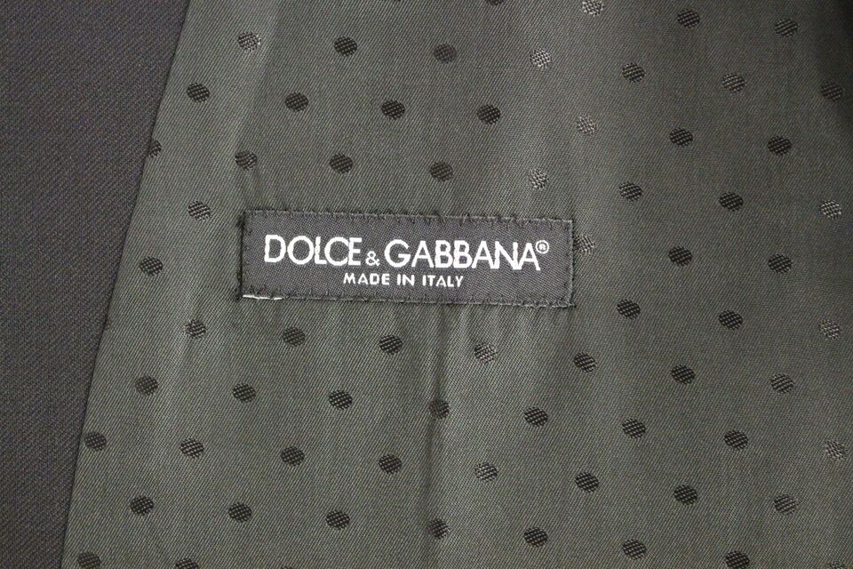 A black wool vest with a polka dot pattern and the brand name "Dolce & Gabbana" on it