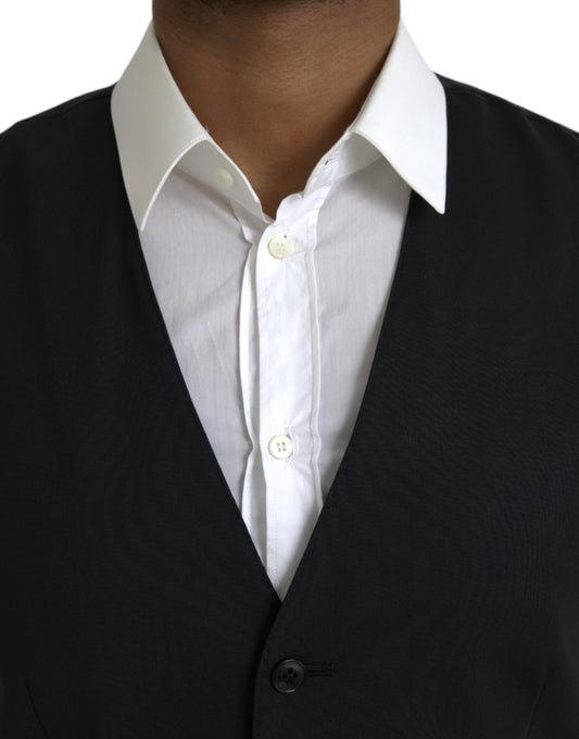 A black wool vest with a white shirt underneath, part of a formal dress ensemble