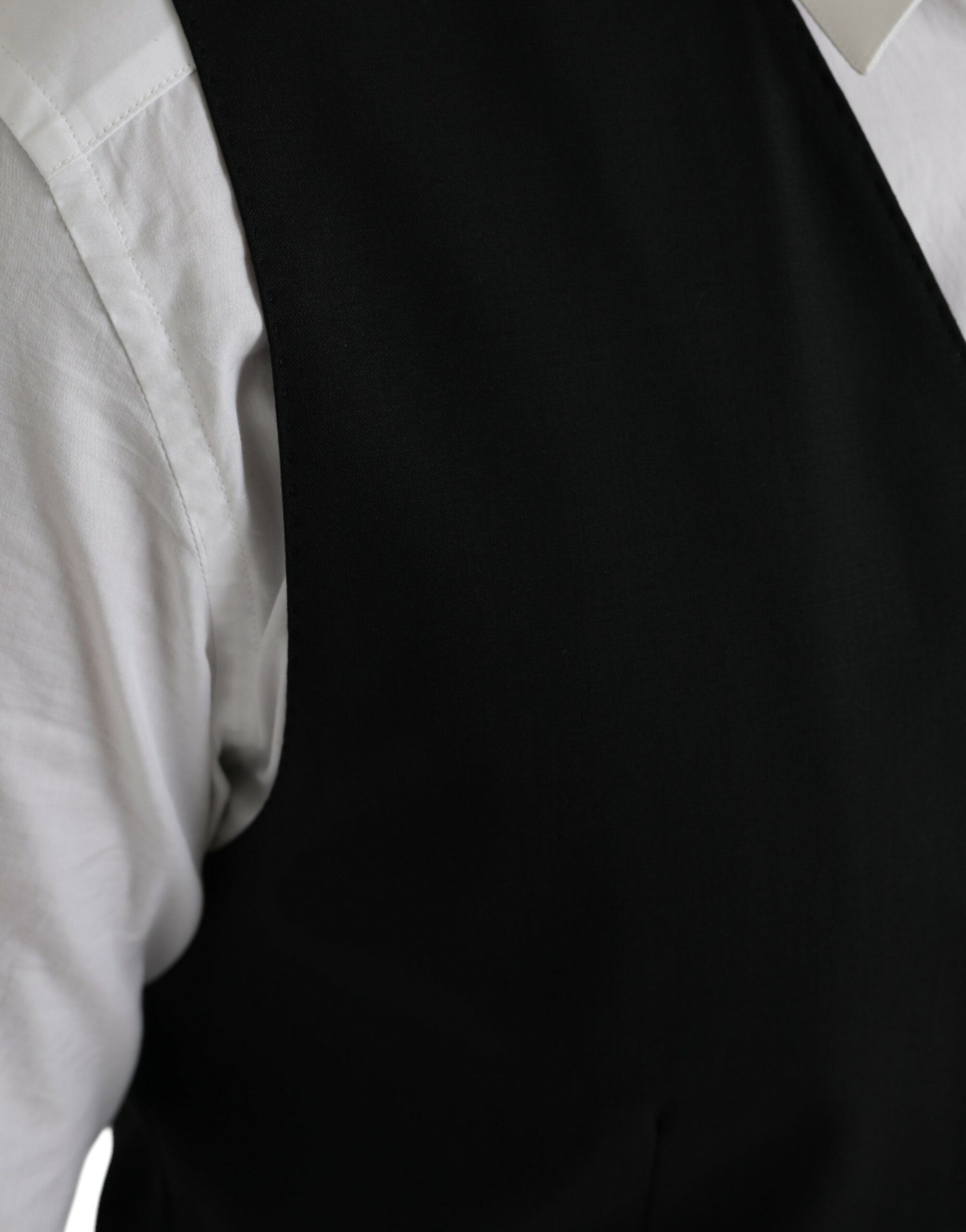 A black wool vest from Dolce & Gabbana, part of a formal dress suit