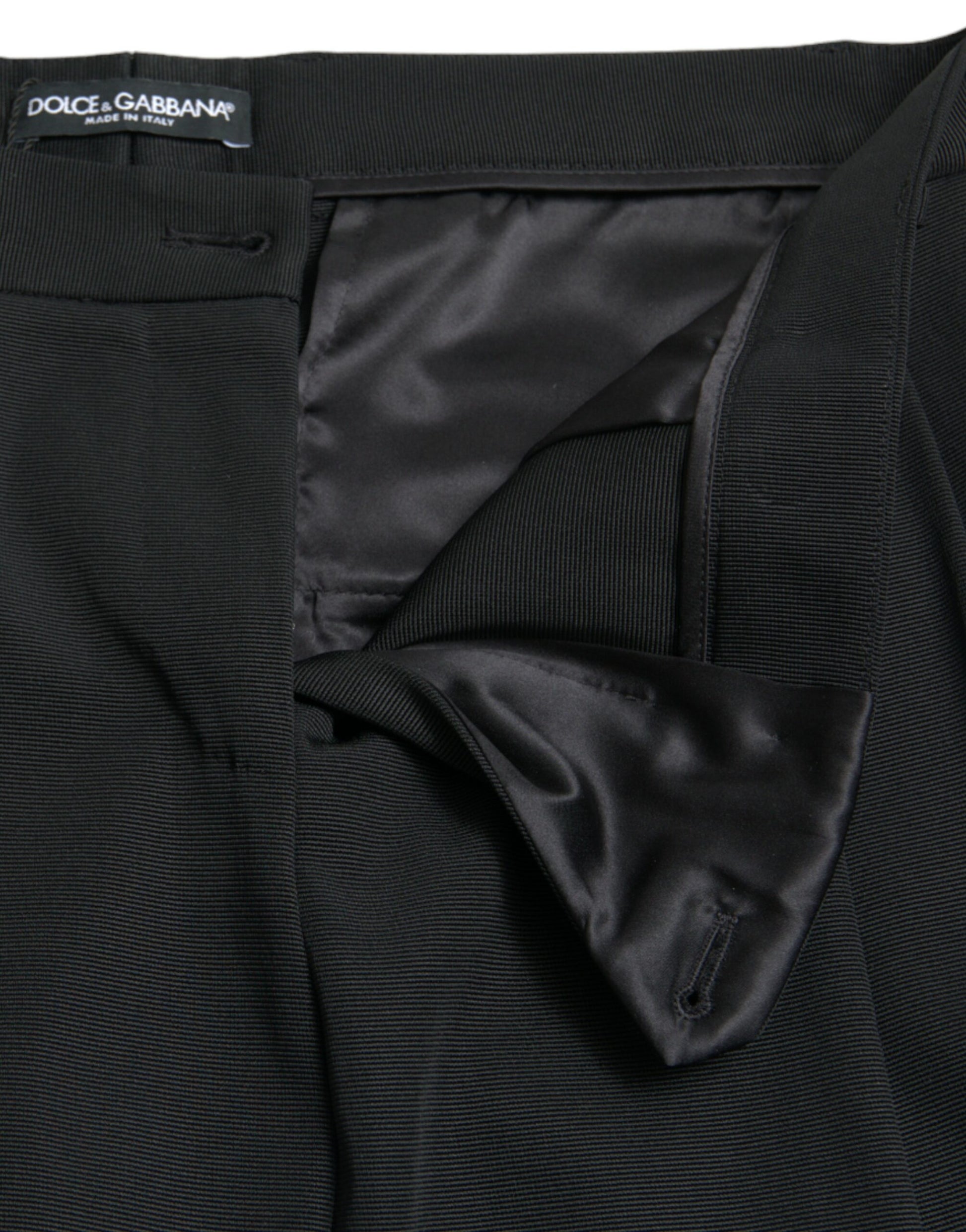 Black pants with a bow tie on the front