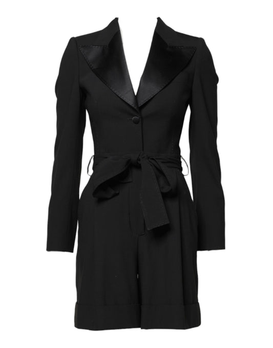 A black wool jumpsuit dress with a belted waist and tie detail