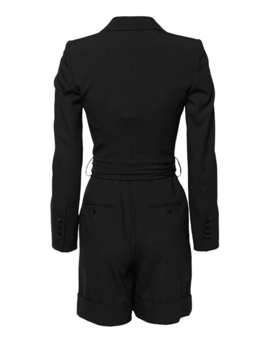 A black wool jumpsuit dress with a fitted waist and long sleeves