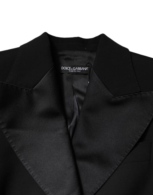 A black wool jumpsuit dress with a V-neckline and a fitted waist