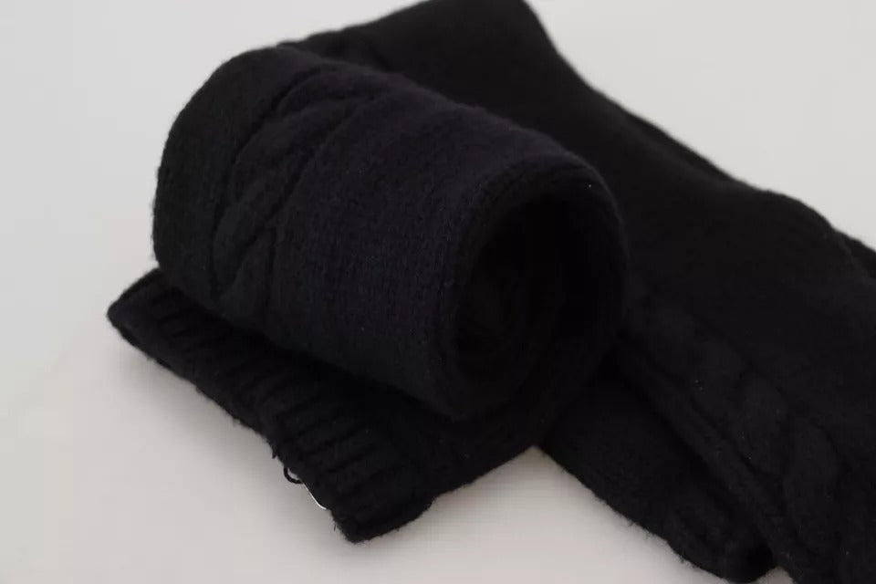 Black cloth headband rolled up on white surface