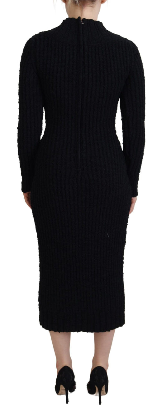 Woman wearing black dress and heels