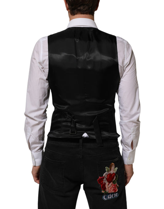 A black wool vest with a floral embroidery on the back