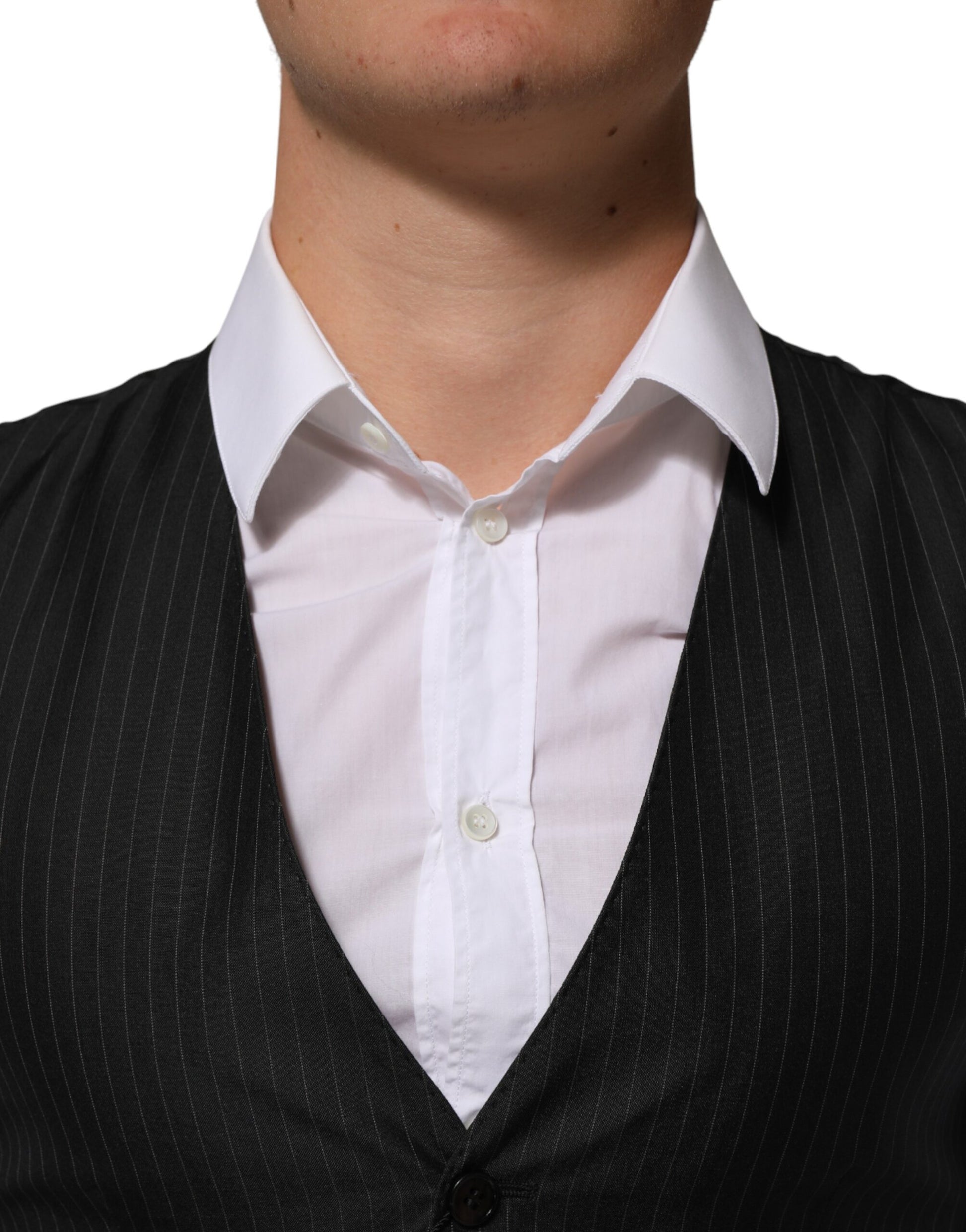 A black wool vest with white buttons, part of a formal men's dress suit