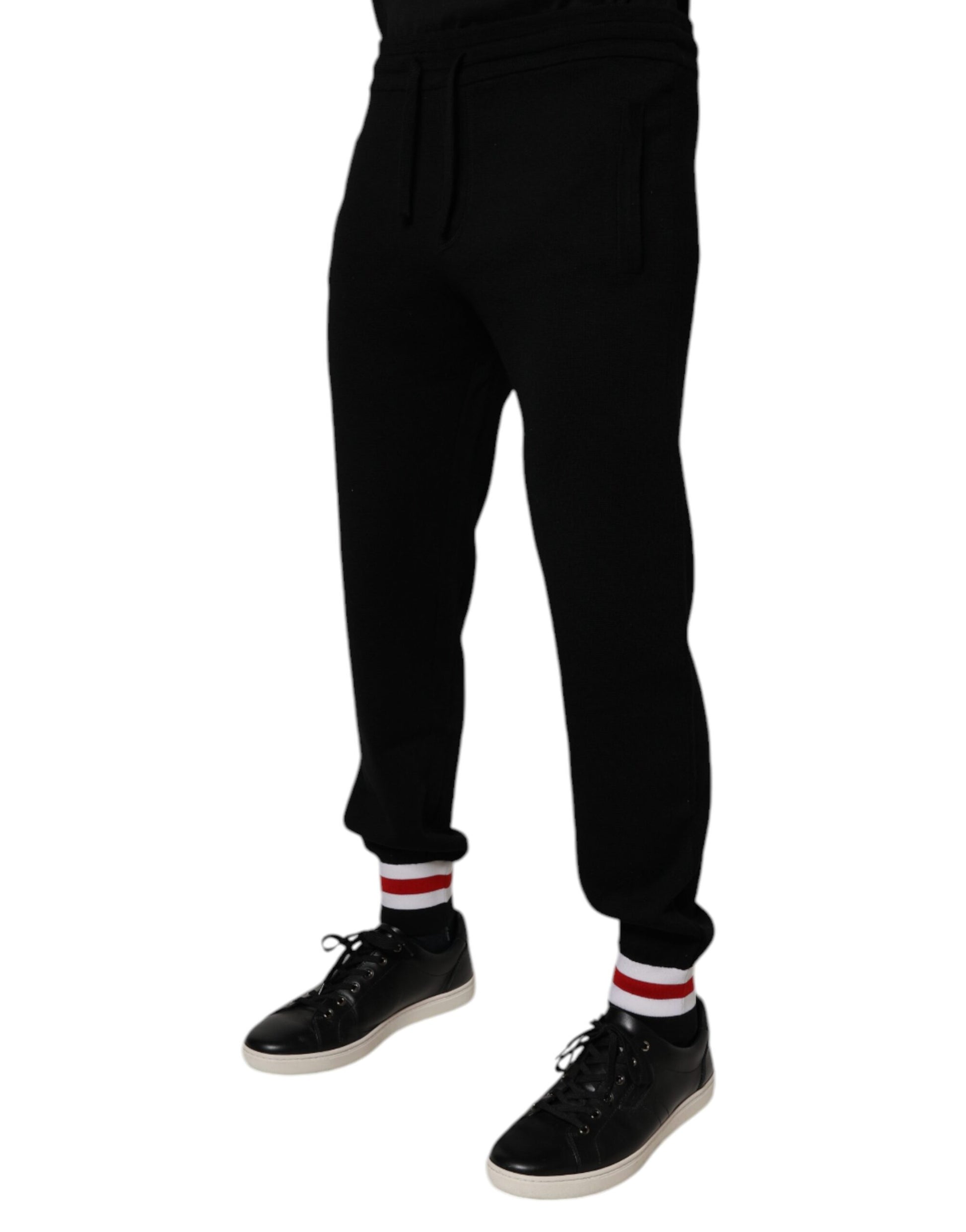 Black track pants with white stripe down side