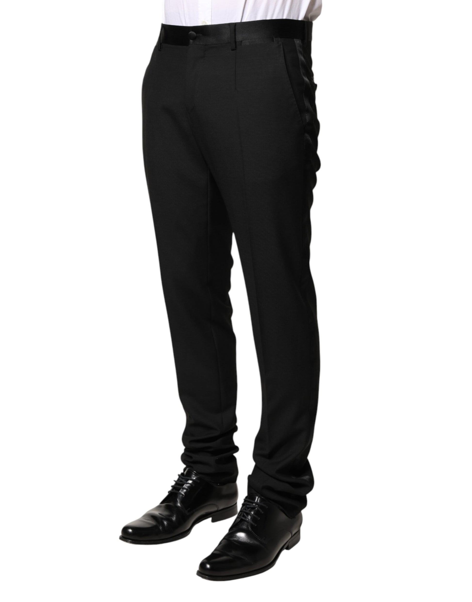 A pair of black wool mid waist dress trousers by Dolce & Gabbana