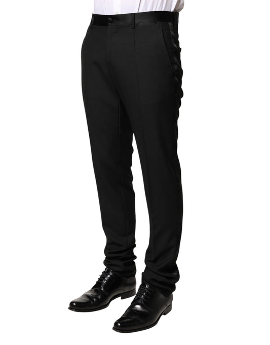 A pair of black wool mid waist dress trousers by Dolce & Gabbana