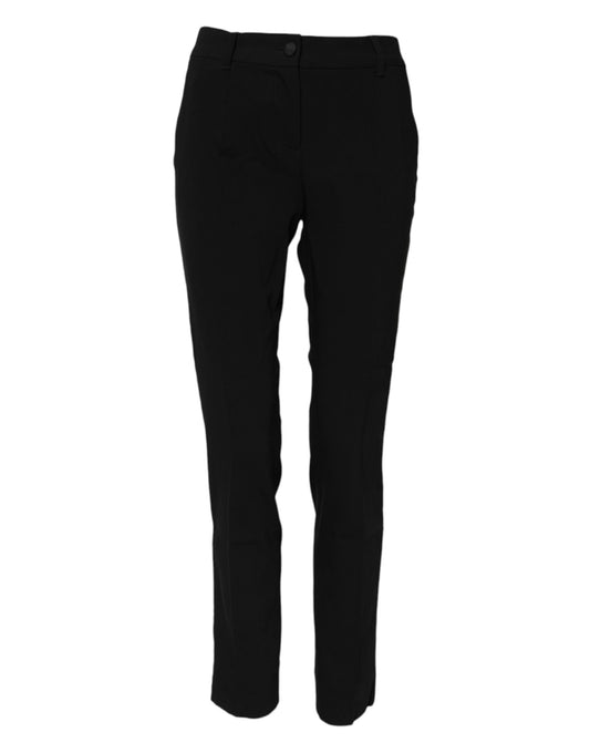 A pair of black wool mid waisted tapered dress pants by Dolce & Gabbana