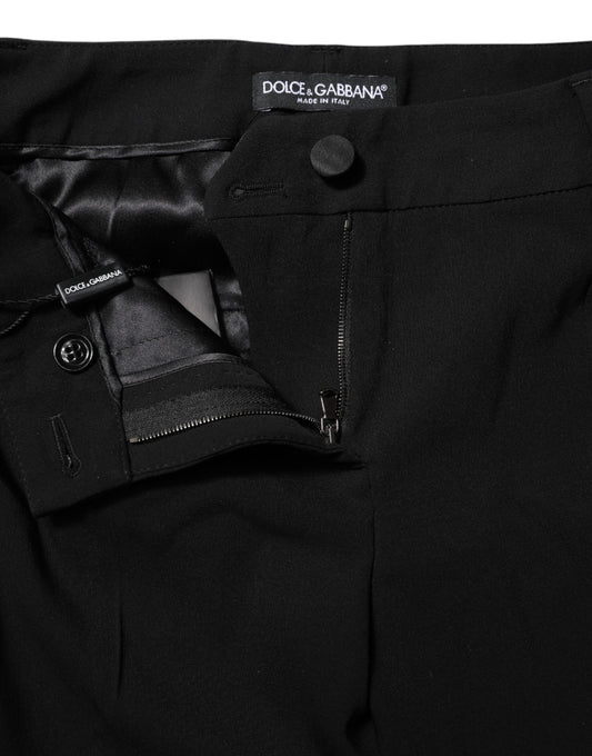 A pair of black wool mid waisted tapered dress pants by Dolce & Gabbana
