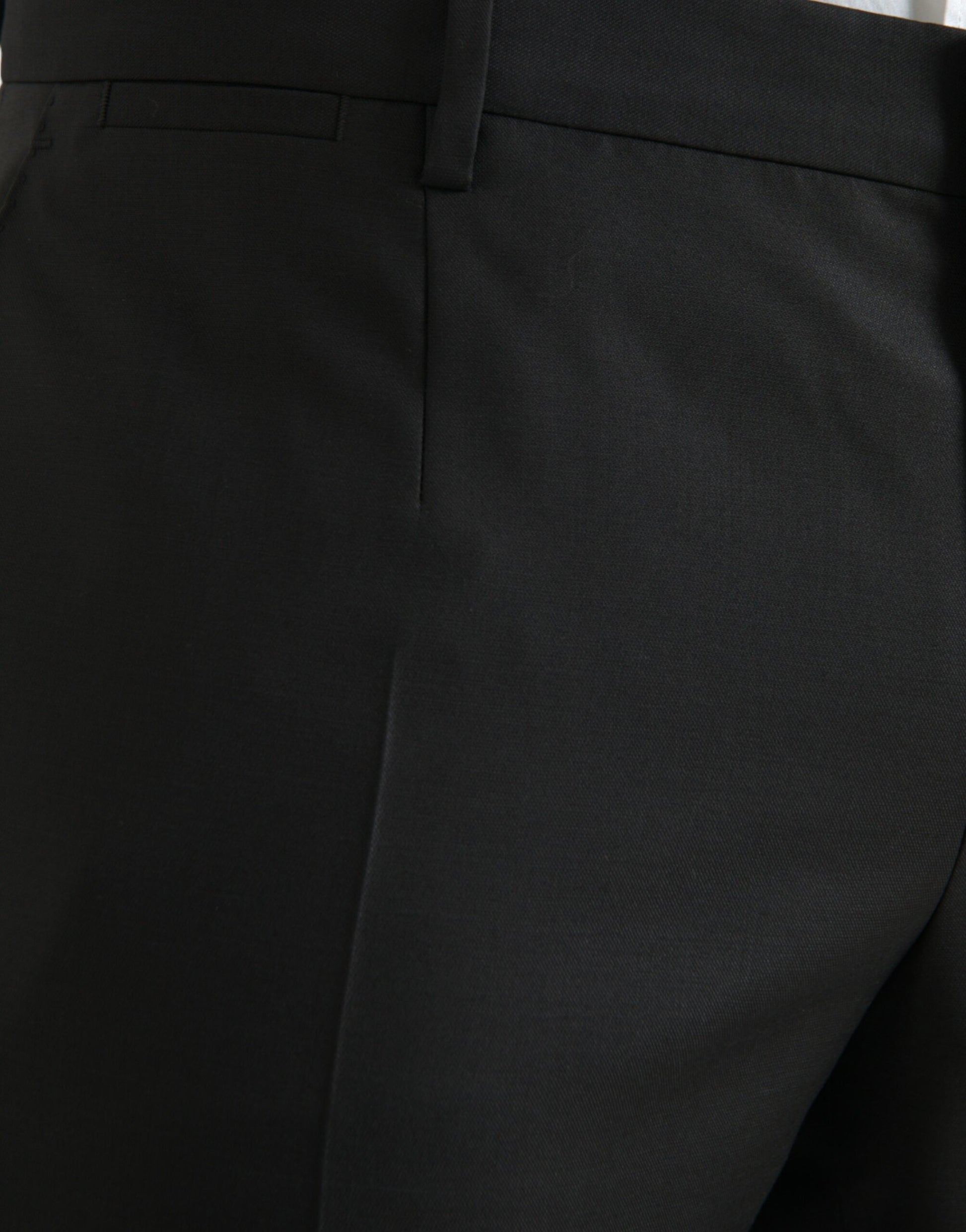 A pair of black wool silk skinny dress pants by Dolce & Gabbana