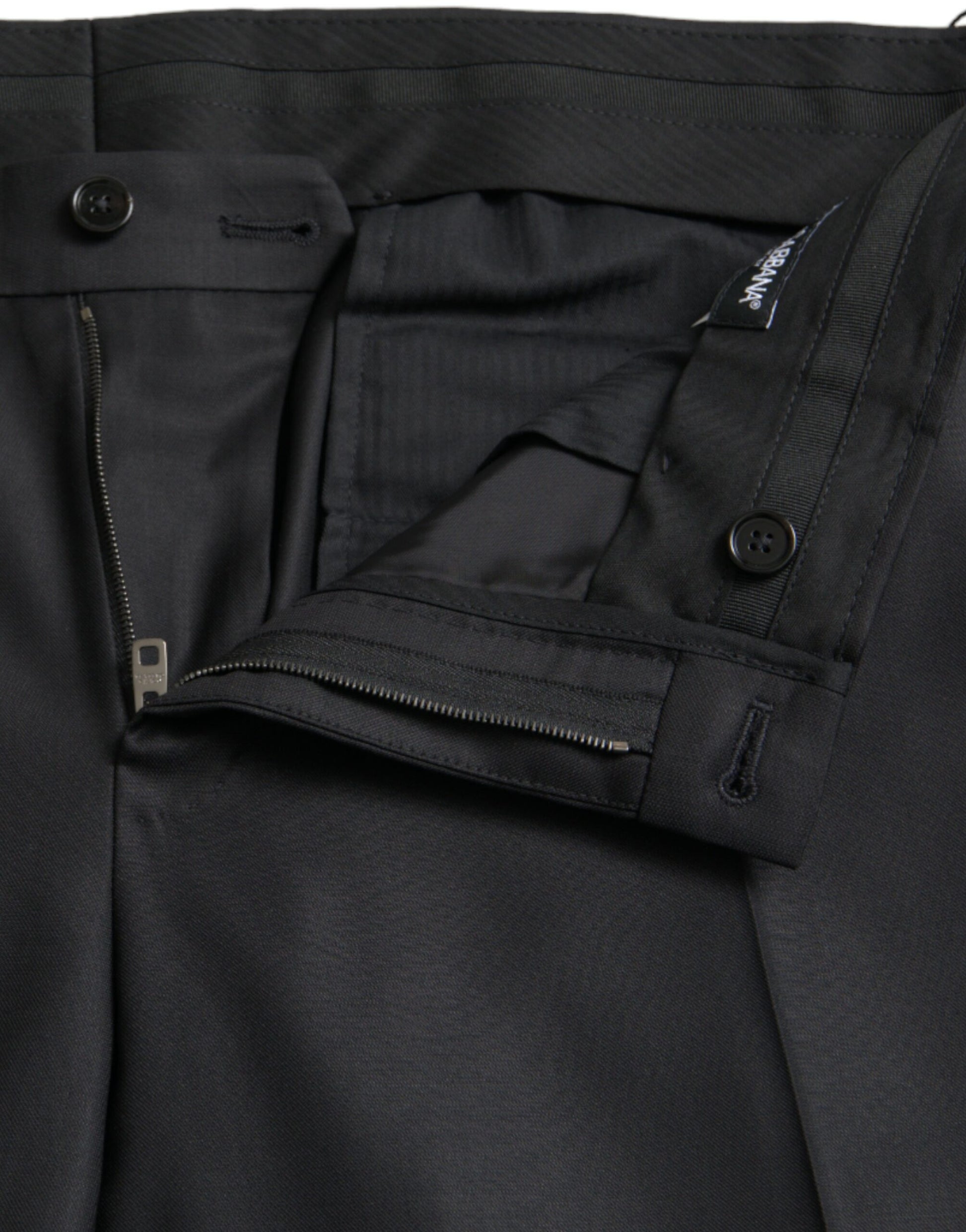 A pair of black wool silk skinny dress pants with zippered pockets