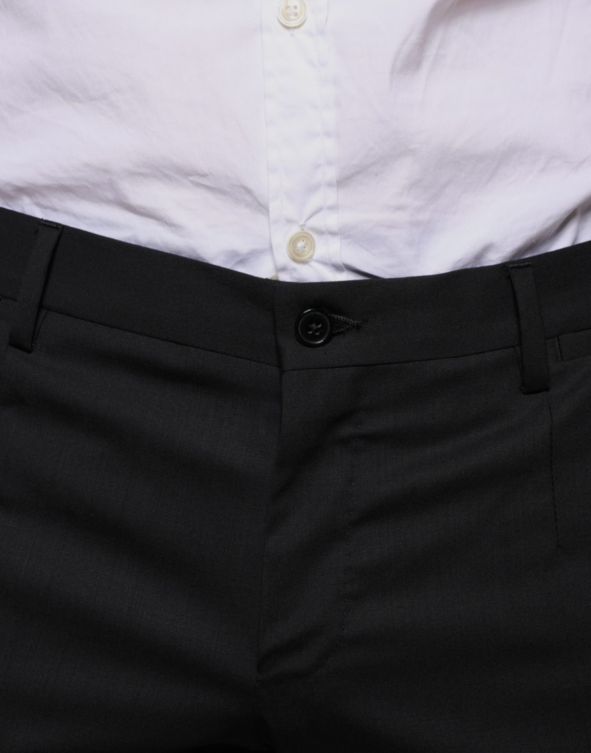 A pair of black wool skinny dress pants from the brand Dolce & Gabbana. They are designed to be formal and fe