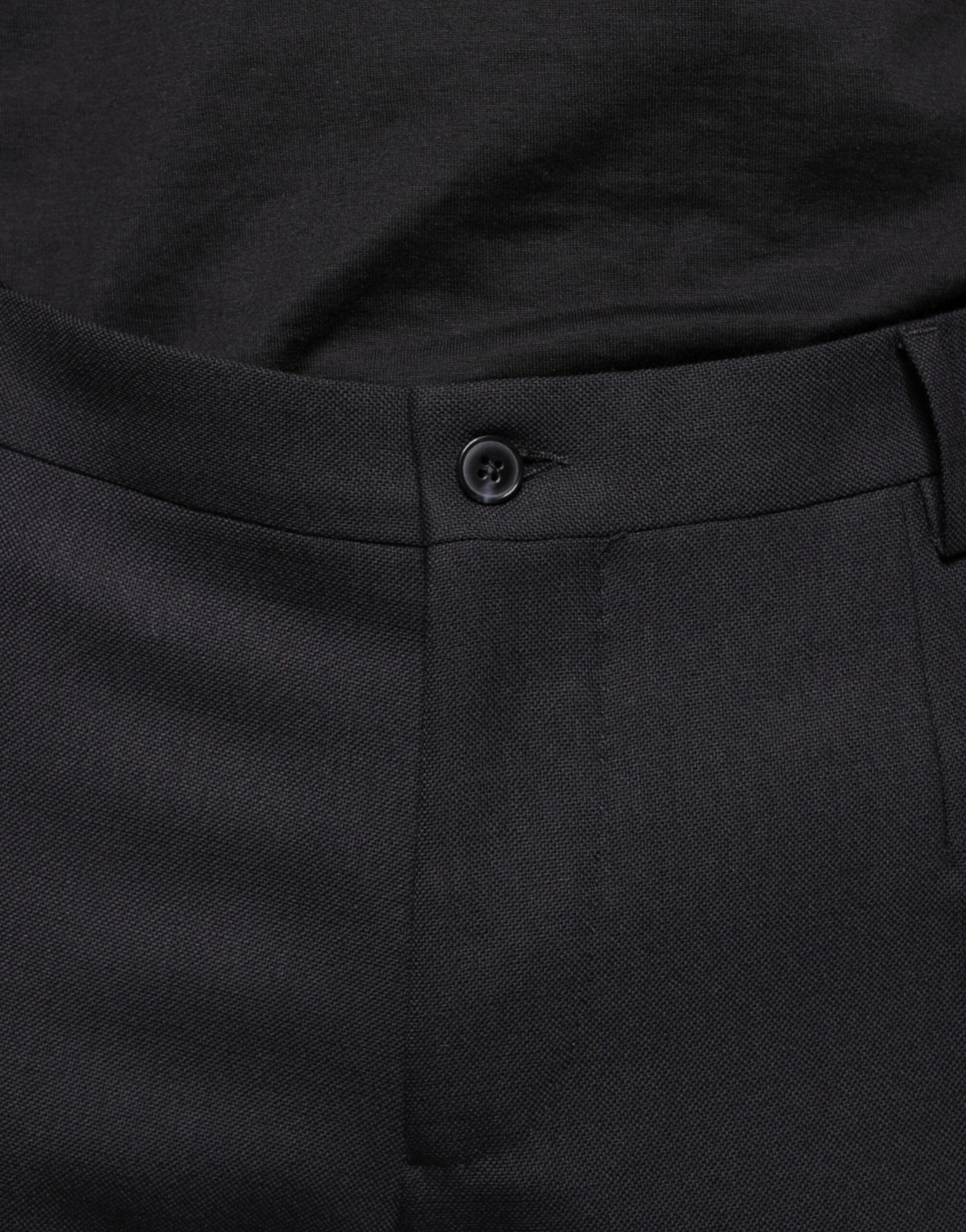 A pair of black wool skinny dress pants from the brand Dolce & Gabbana. They are designed for formal wear and