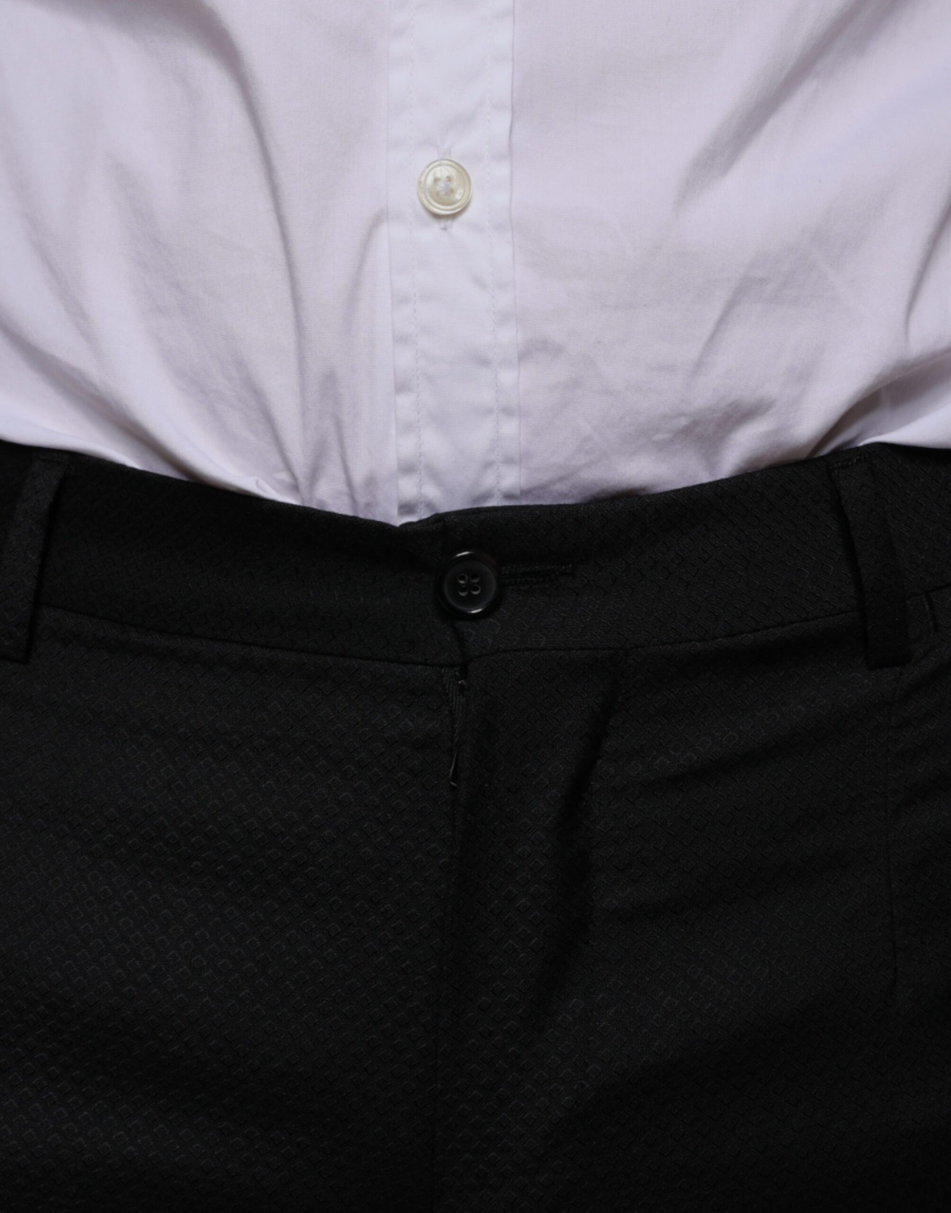 A pair of black wool skinny dress pants from the brand Dolce & Gabbana. They are designed with a slim fit and