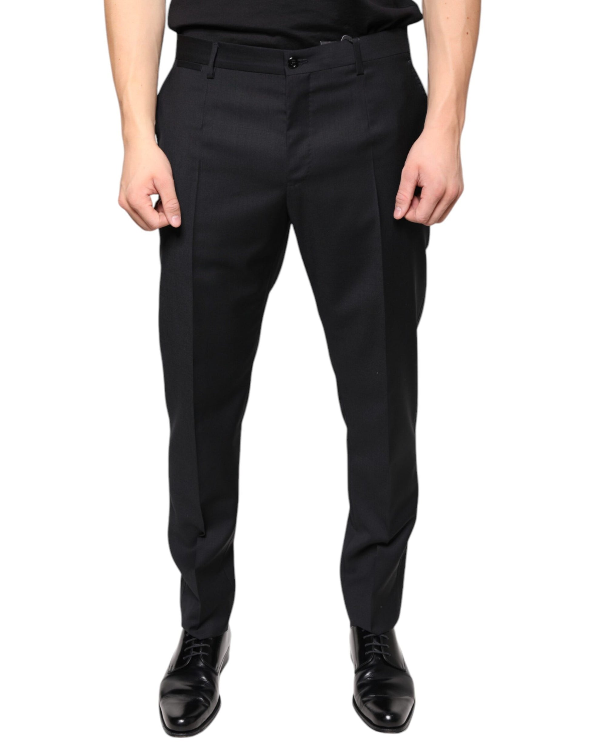 A pair of black wool skinny dress pants by Dolce & Gabbana for men