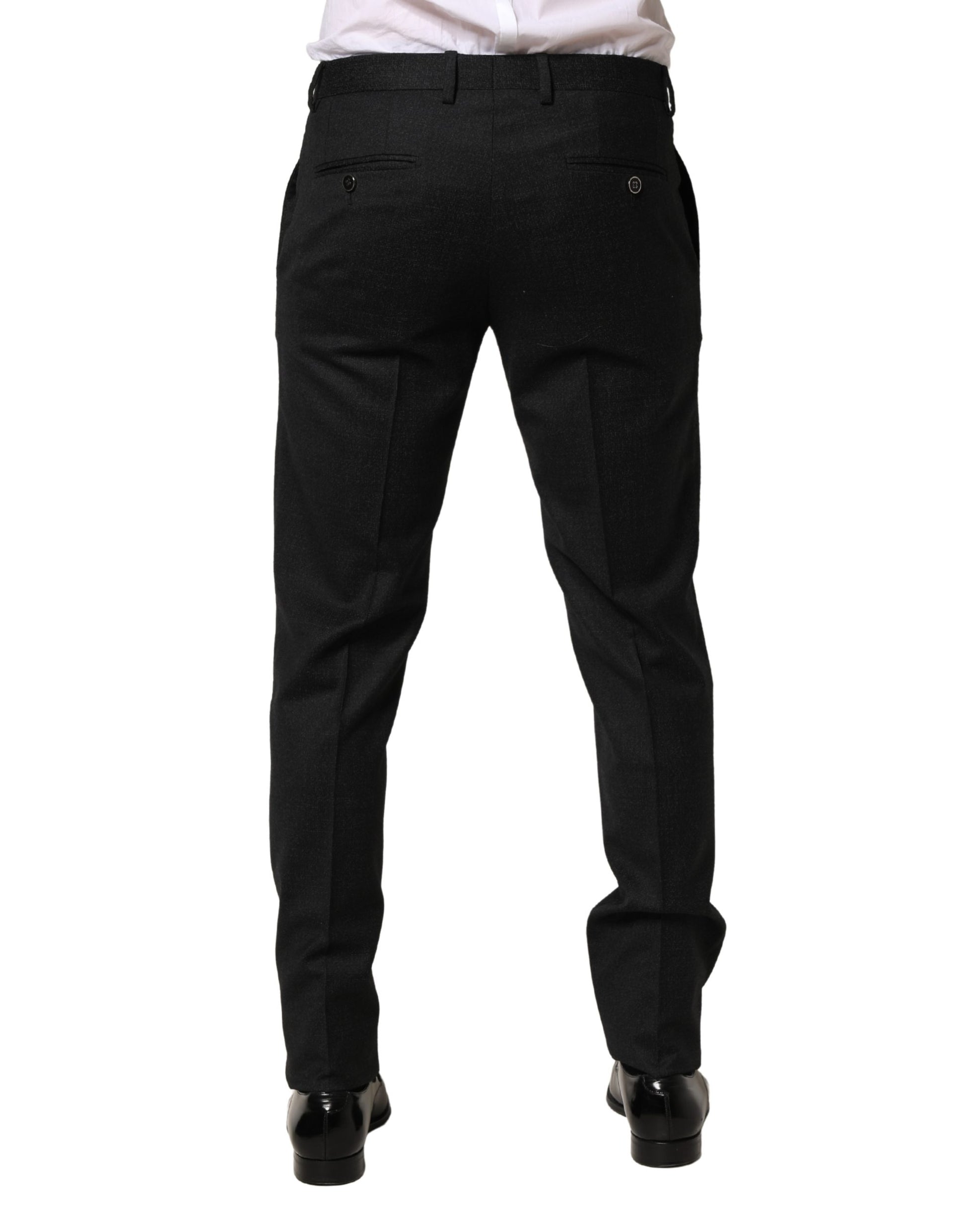 A pair of black wool skinny dress trousers from the brand Dolce & Gabbana. They are designed for men and feat