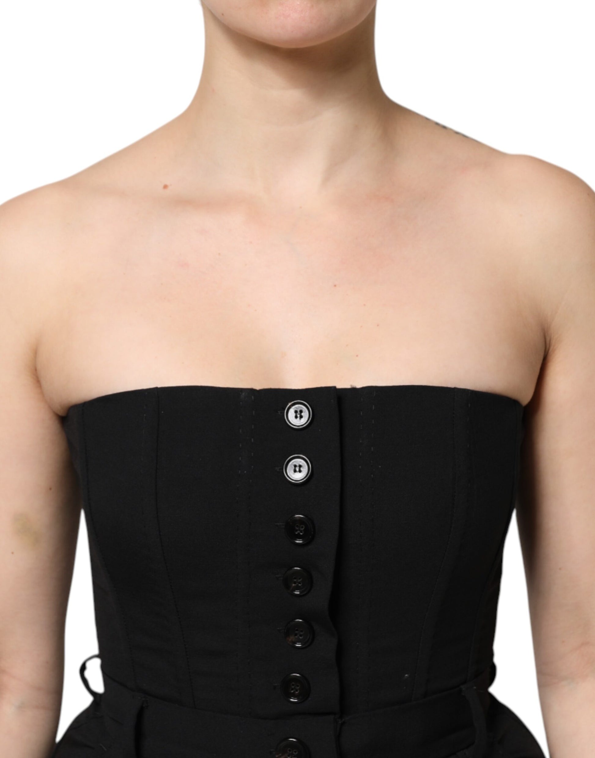 A black wool strapless romper jumpsuit dress with buttons and a waist belt