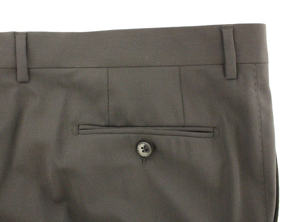 Pair of dark gray dress pants with pockets and buttoned flap on front