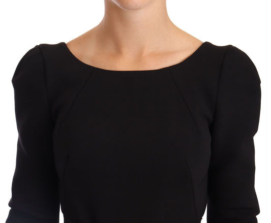 A black wool stretch sheath dress with an open back, featuring a V-neckline and short sleeves