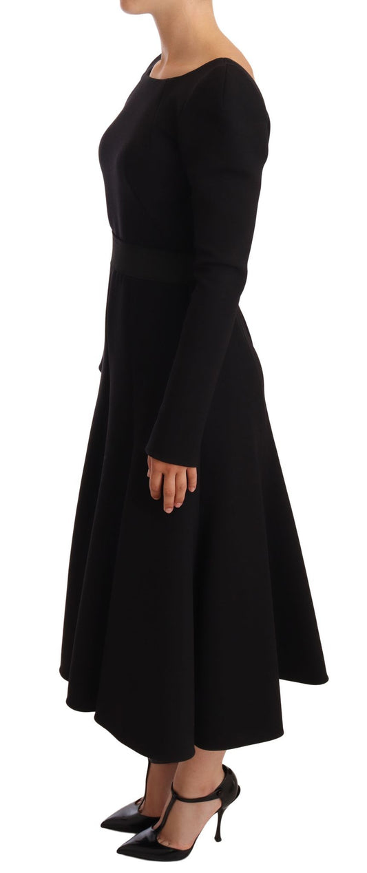 A black wool stretch sheath dress with open back and high heels