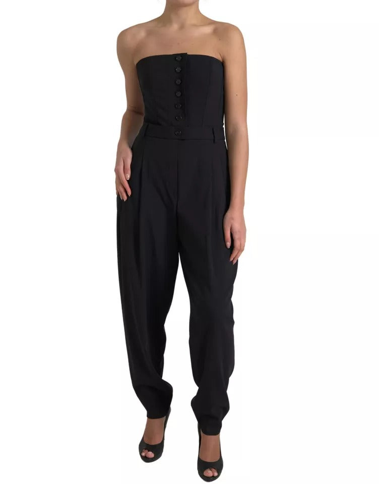 A black wool stretch strapless jumpsuit dress with a fitted waist and wide-leg pants