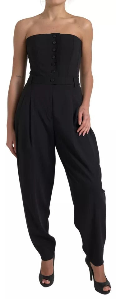 A black wool stretch strapless jumpsuit dress with a fitted waist and wide-leg pants