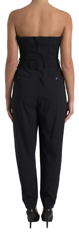 A black wool stretch strapless jumpsuit dress with a fitted bodice and flared pants