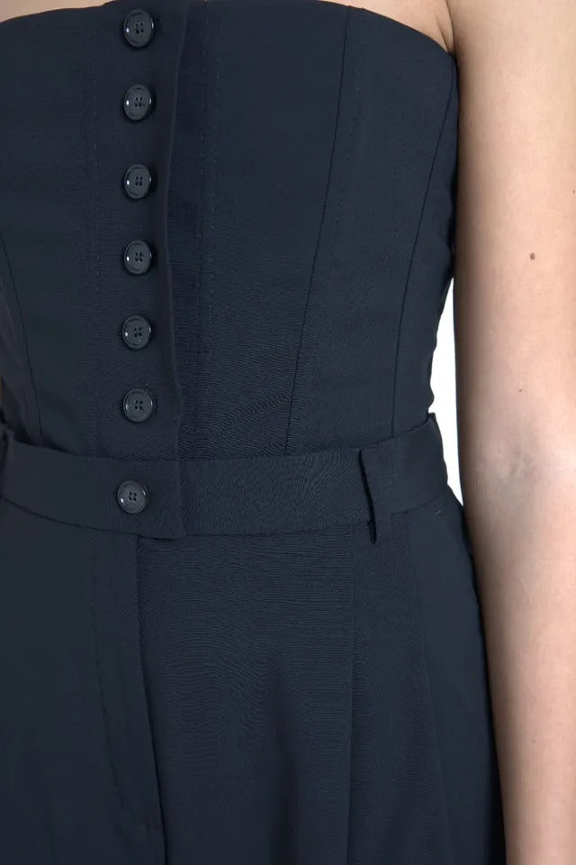 A black wool stretch strapless jumpsuit dress with buttons down the front