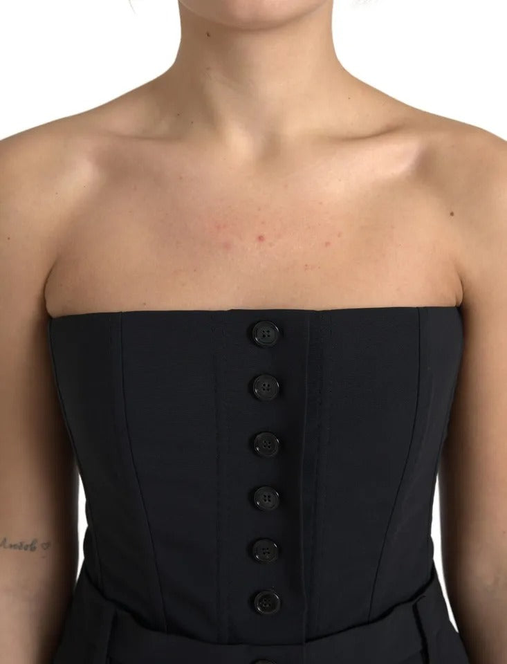 A black strapless jumpsuit dress with wool and stretch fabric, featuring a fitted waist and buttons down the front