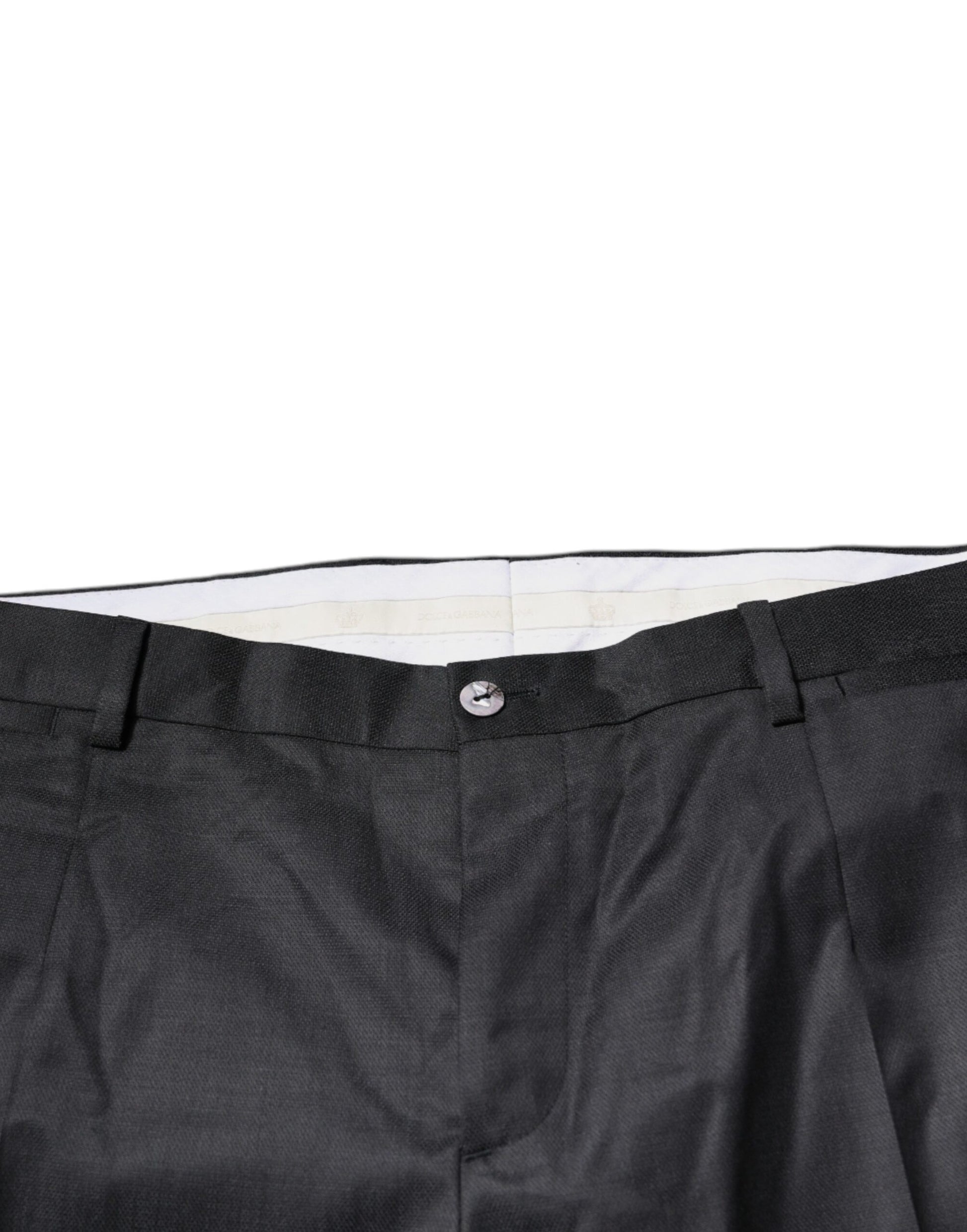 A pair of black wool tapered formal dress pants from the brand Dolce & Gabbana