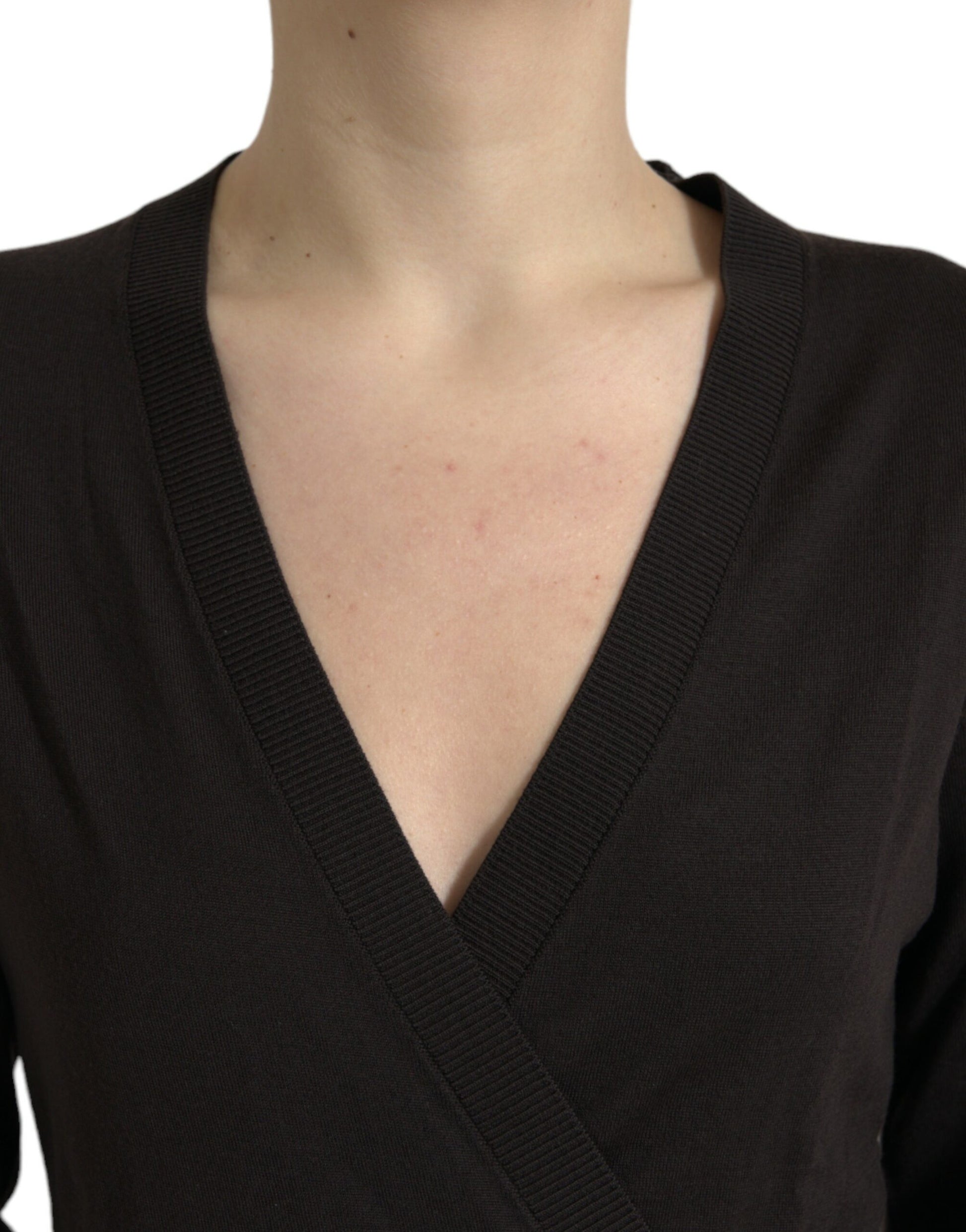 Woman wearing black v-neck sweater
