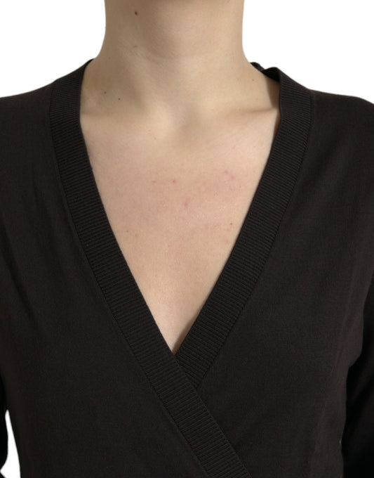 Woman wearing black v-neck sweater