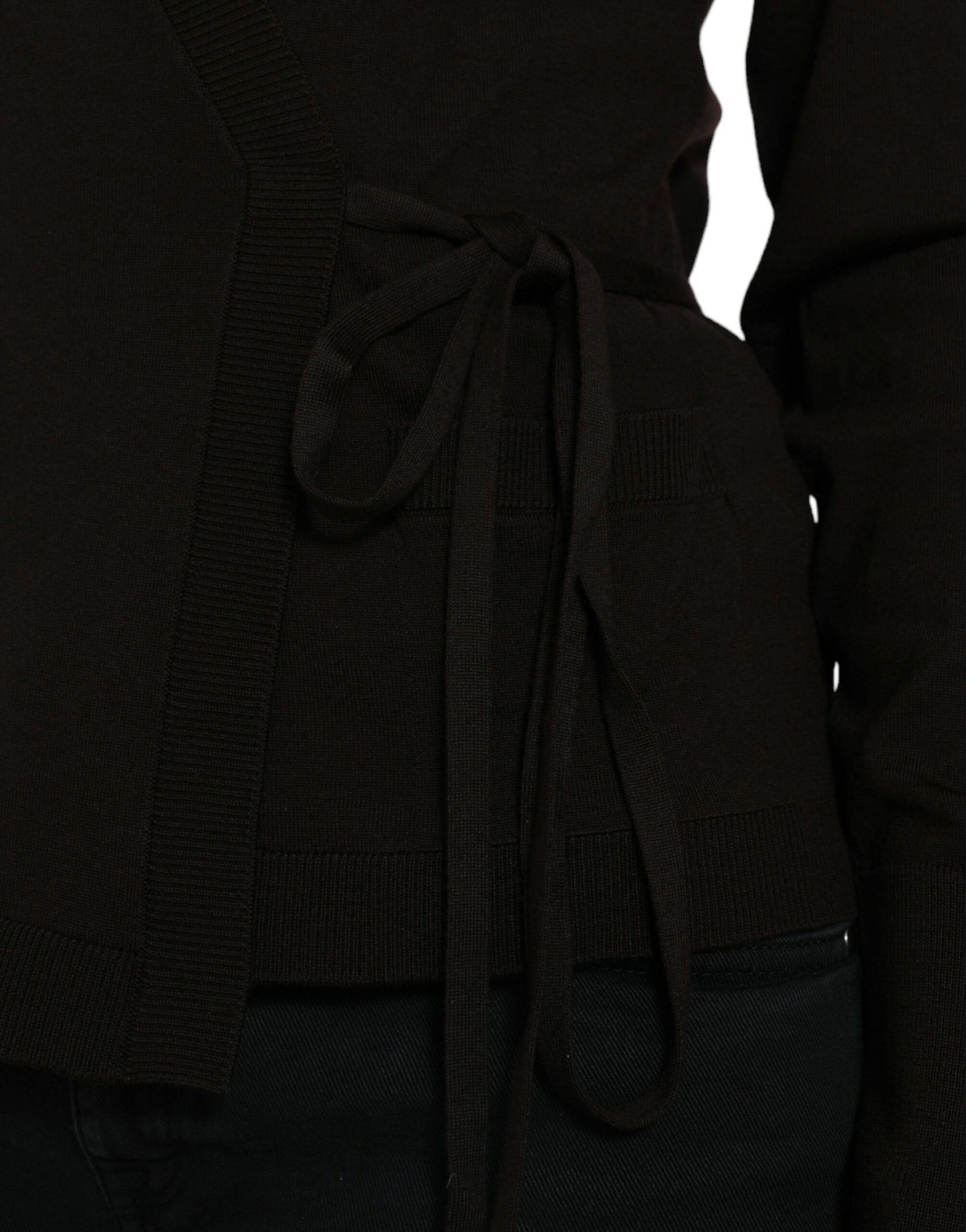 Dark knit sweater with bow tie detail on front