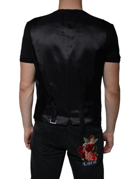 A black wool vest with a floral embroidery on the back