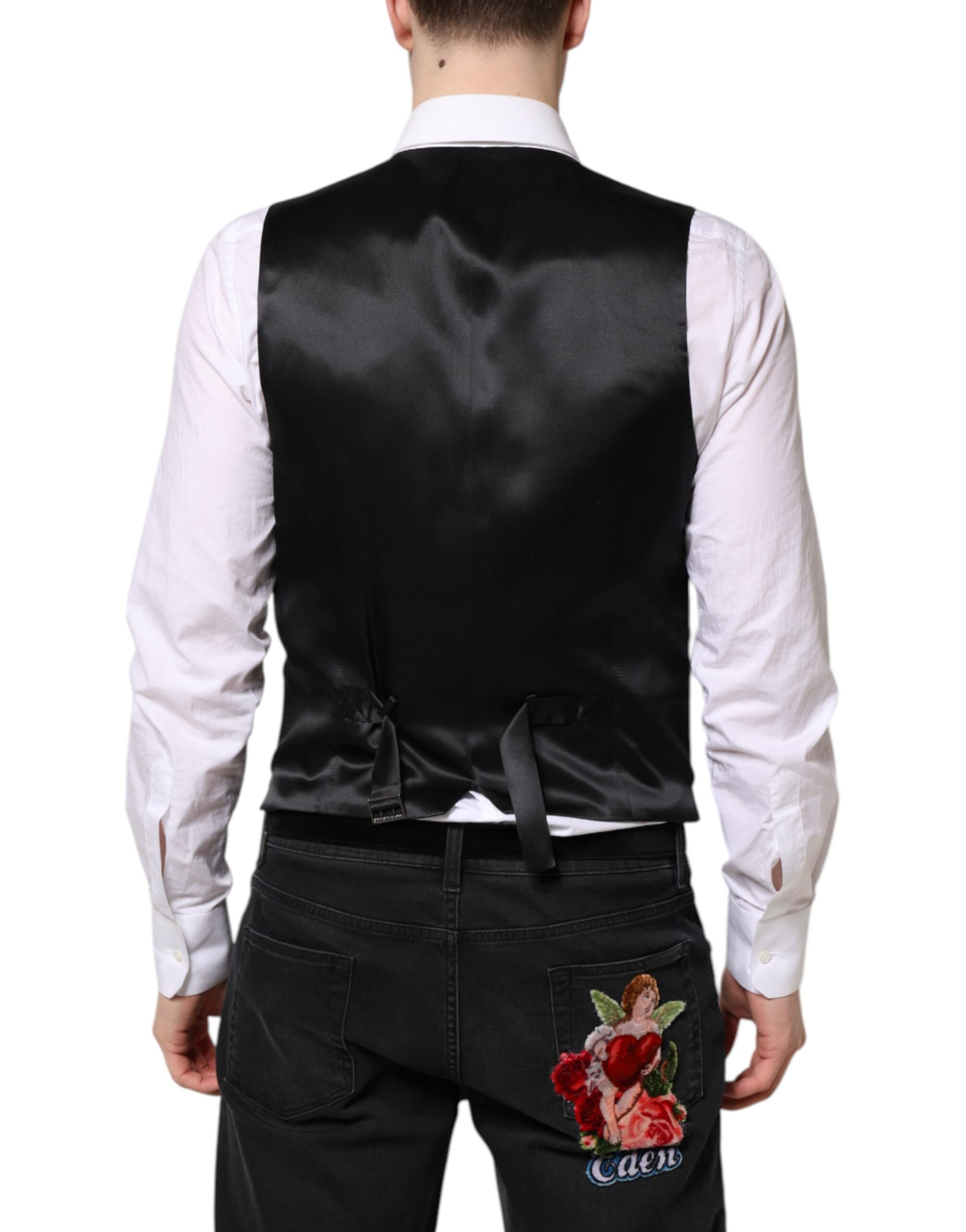 A black wool vest with a rose embroidered on the back