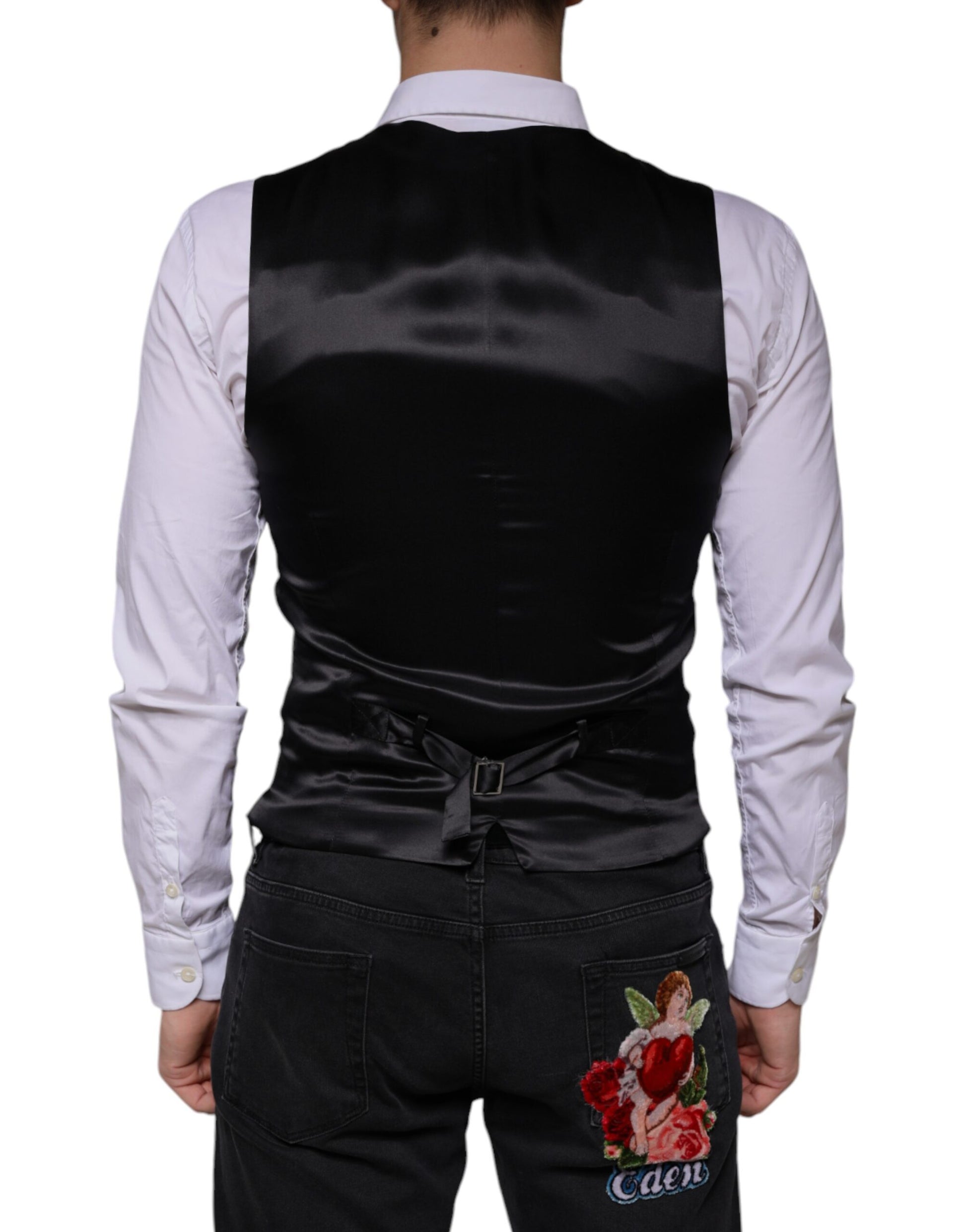 A black wool vest with a lapel and a floral embroidery on the back