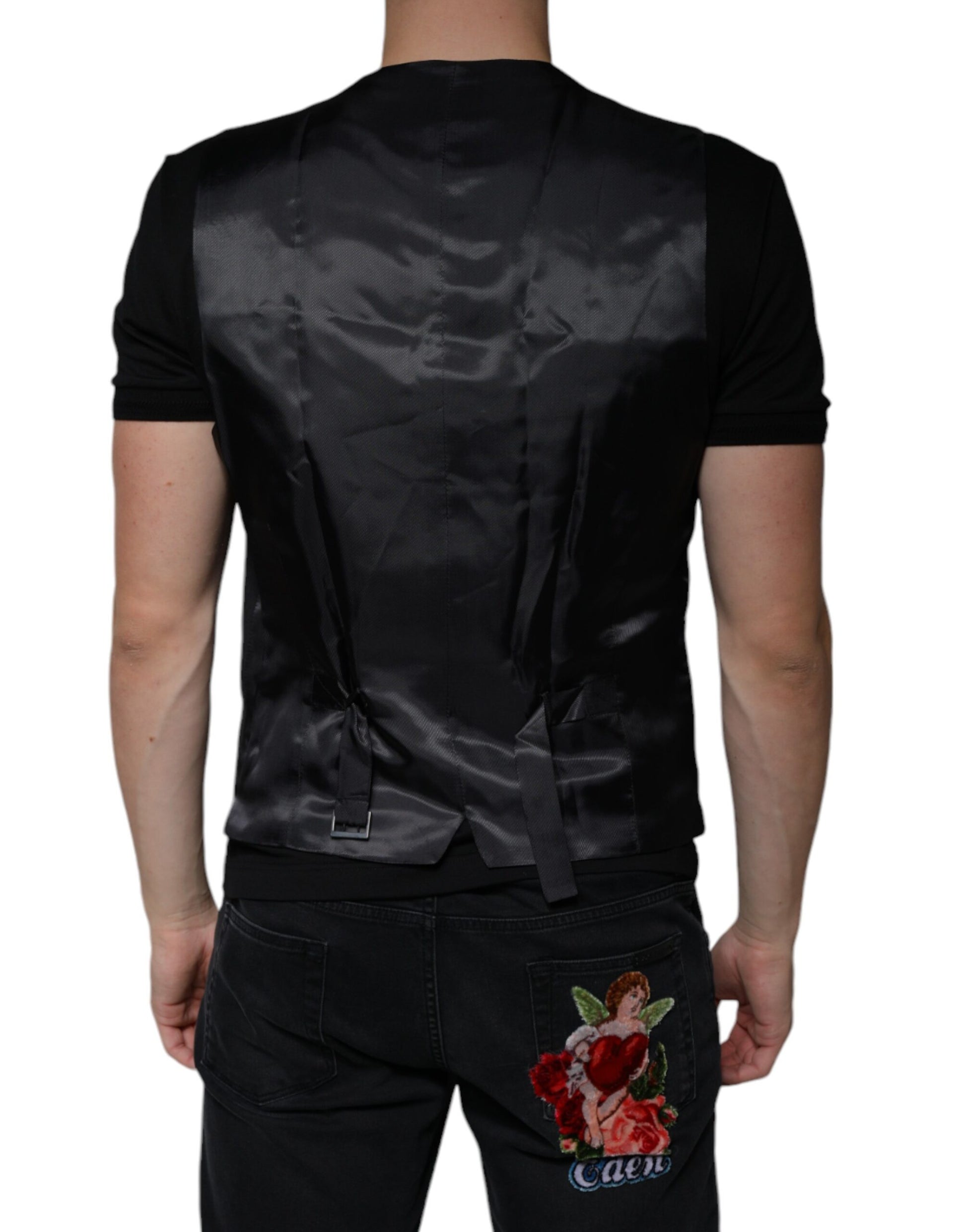A black wool vest with a lapel and a floral embroidered patch on the back