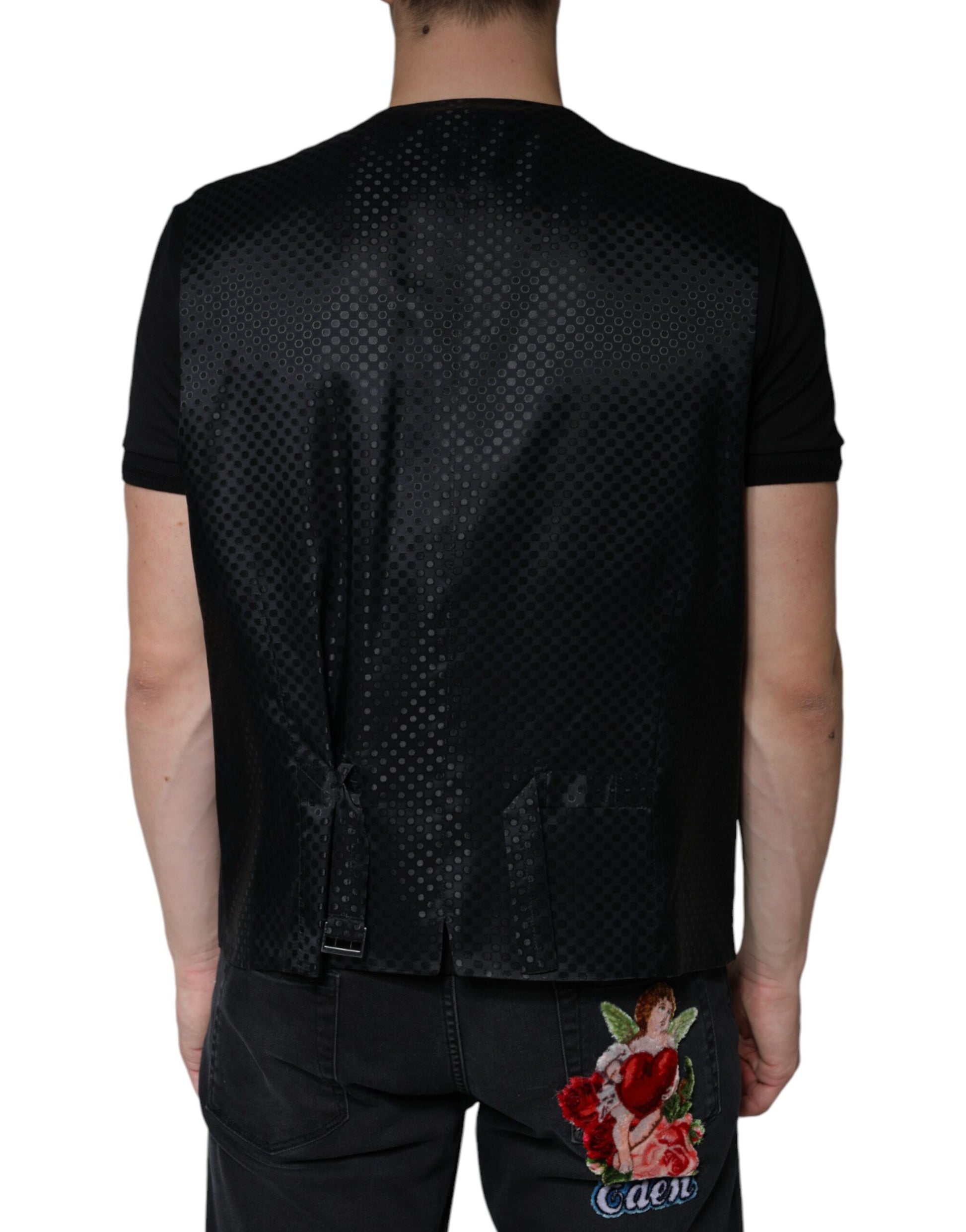 A black wool waistcoat with a floral embroidery on the back