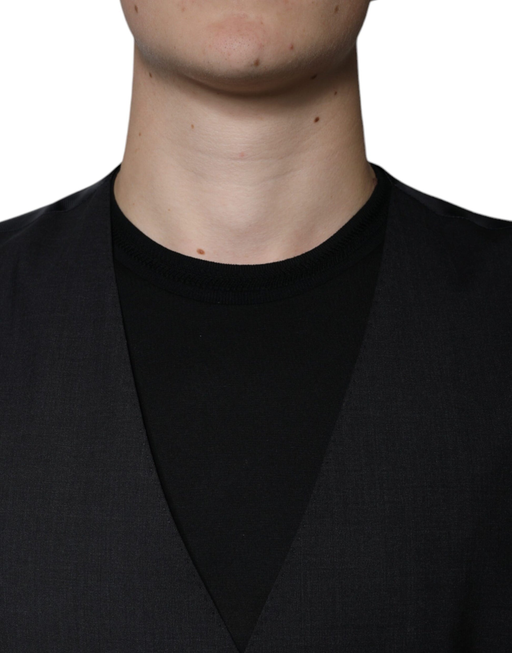 A black wool vest with a notched collar, worn by a mannequin