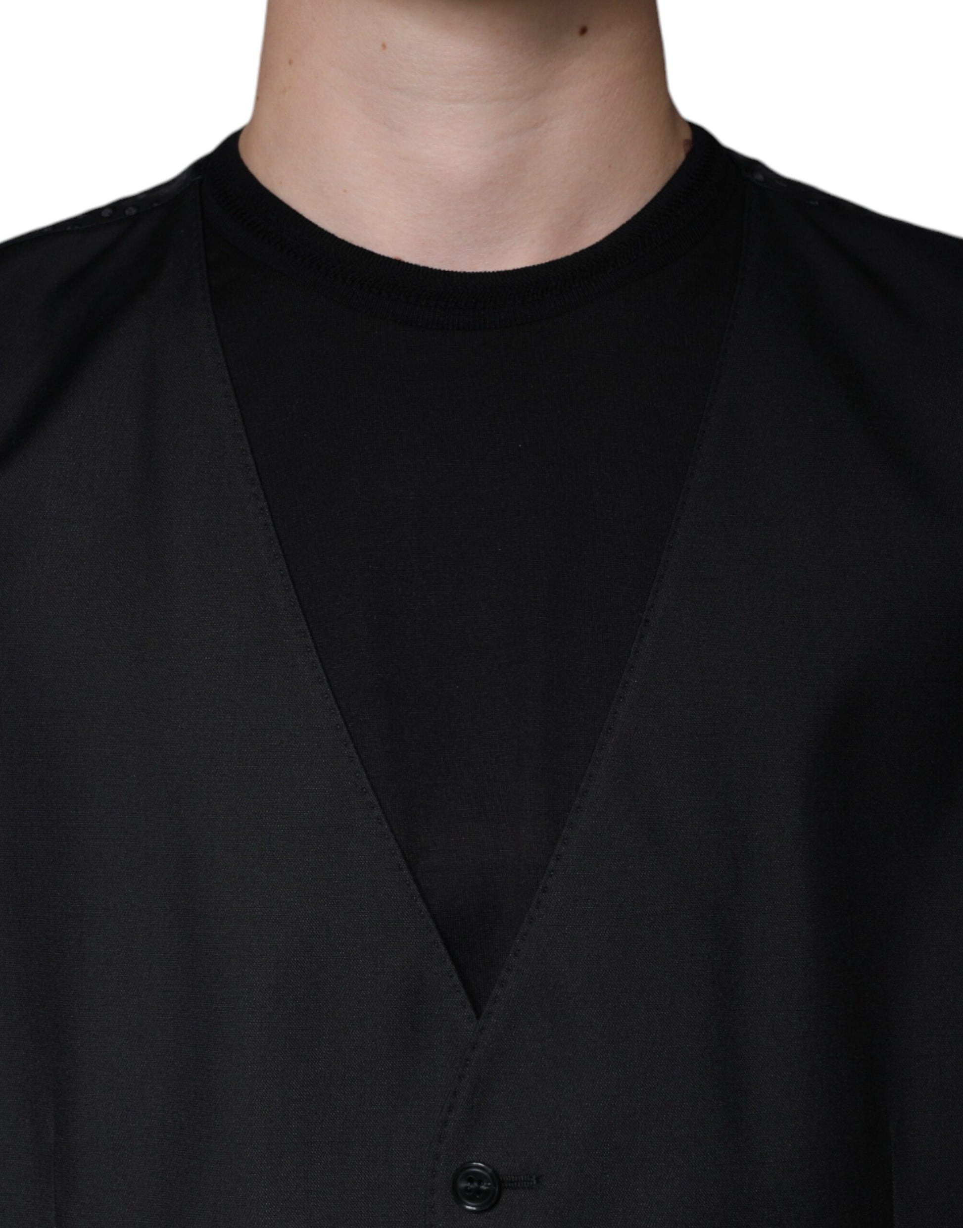 A black wool vest with a notched collar and two front pockets