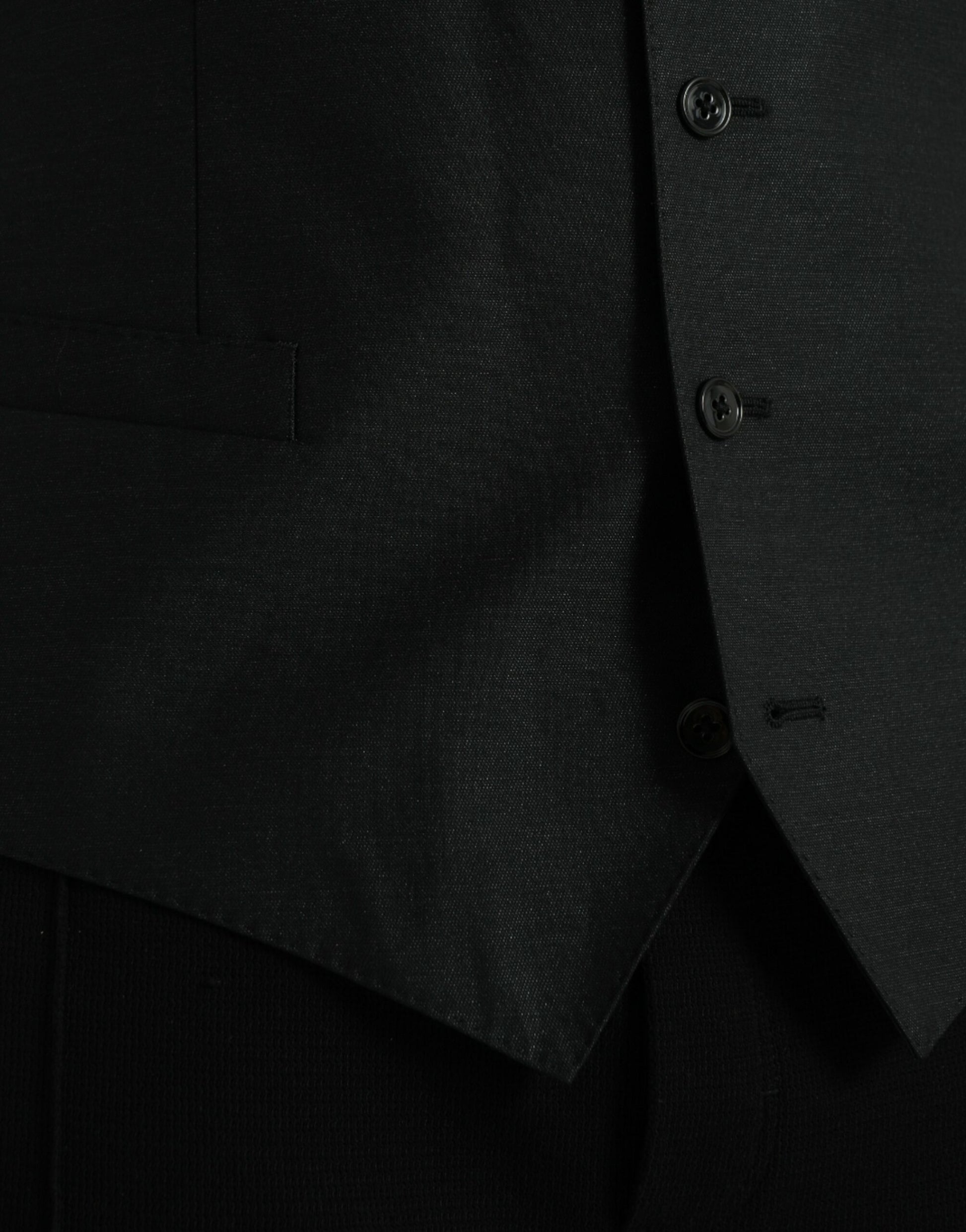 A black wool waistcoat with a textured pattern, featuring three buttons and a notched collar