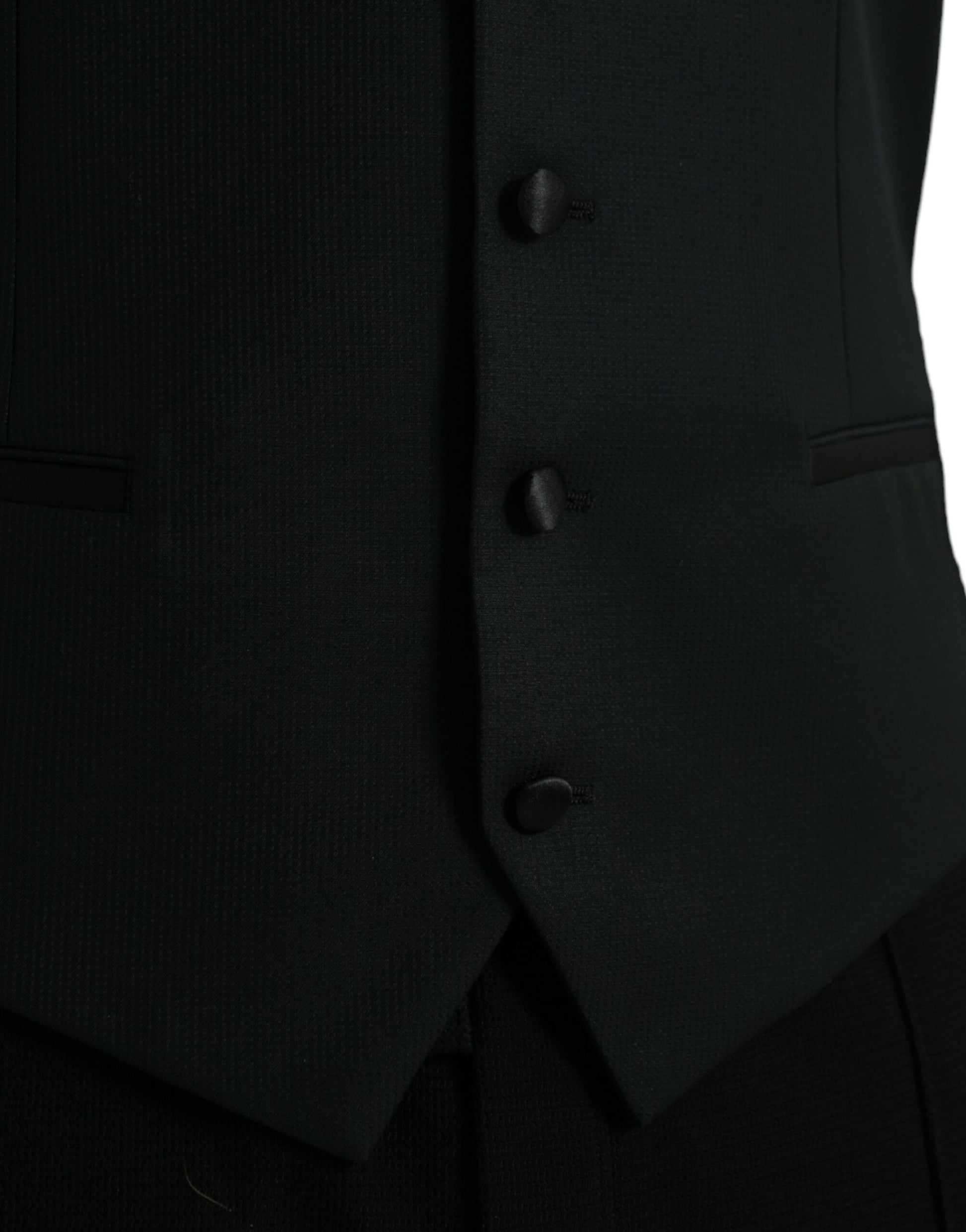 A black wool waistcoat with three buttons, part of a formal dress suit