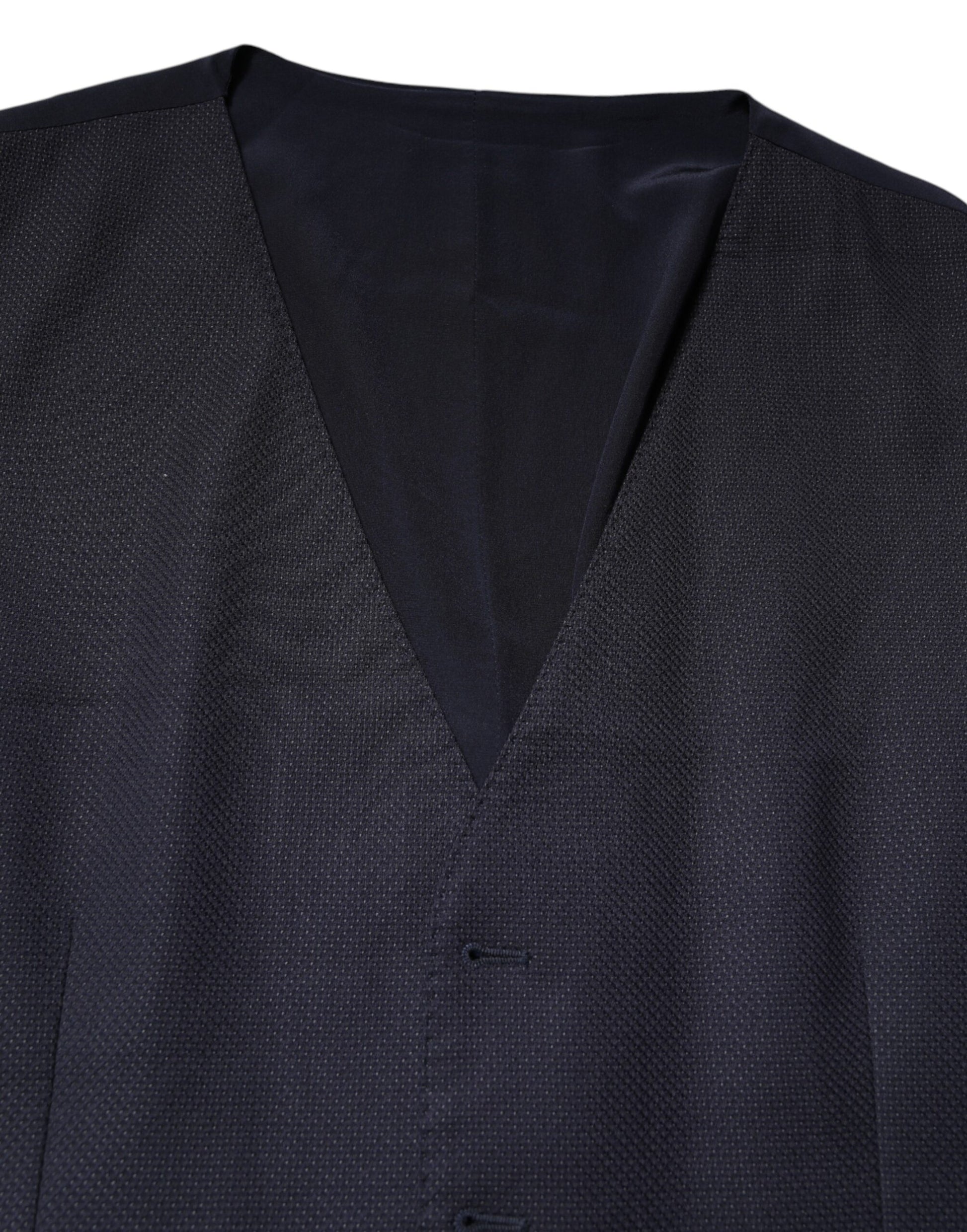 A black wool vest with a textured pattern, part of a formal dress ensemble